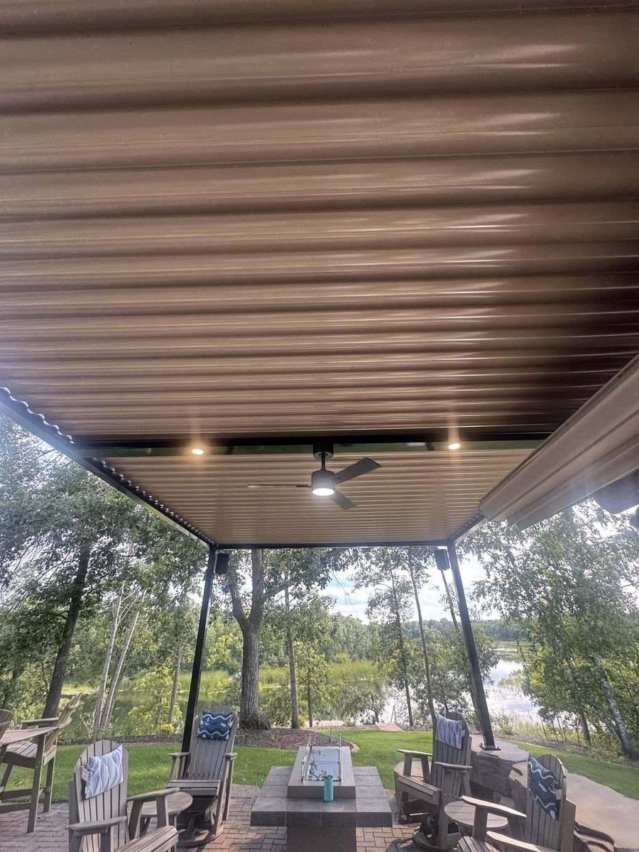 Closed aluminum louvers overhead with integrated lights on