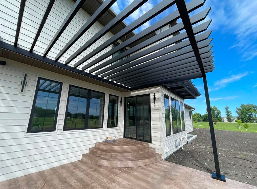 Louvered roof blades and structural beam seen from beneath a TiDAL-X pergola